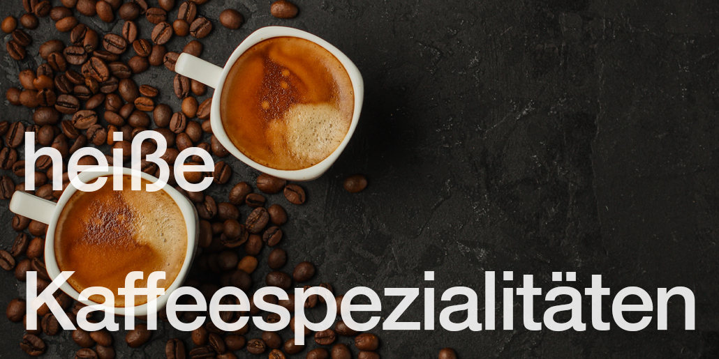 heisse Kaffeespzialitäten Cappuccino mit Bohnen